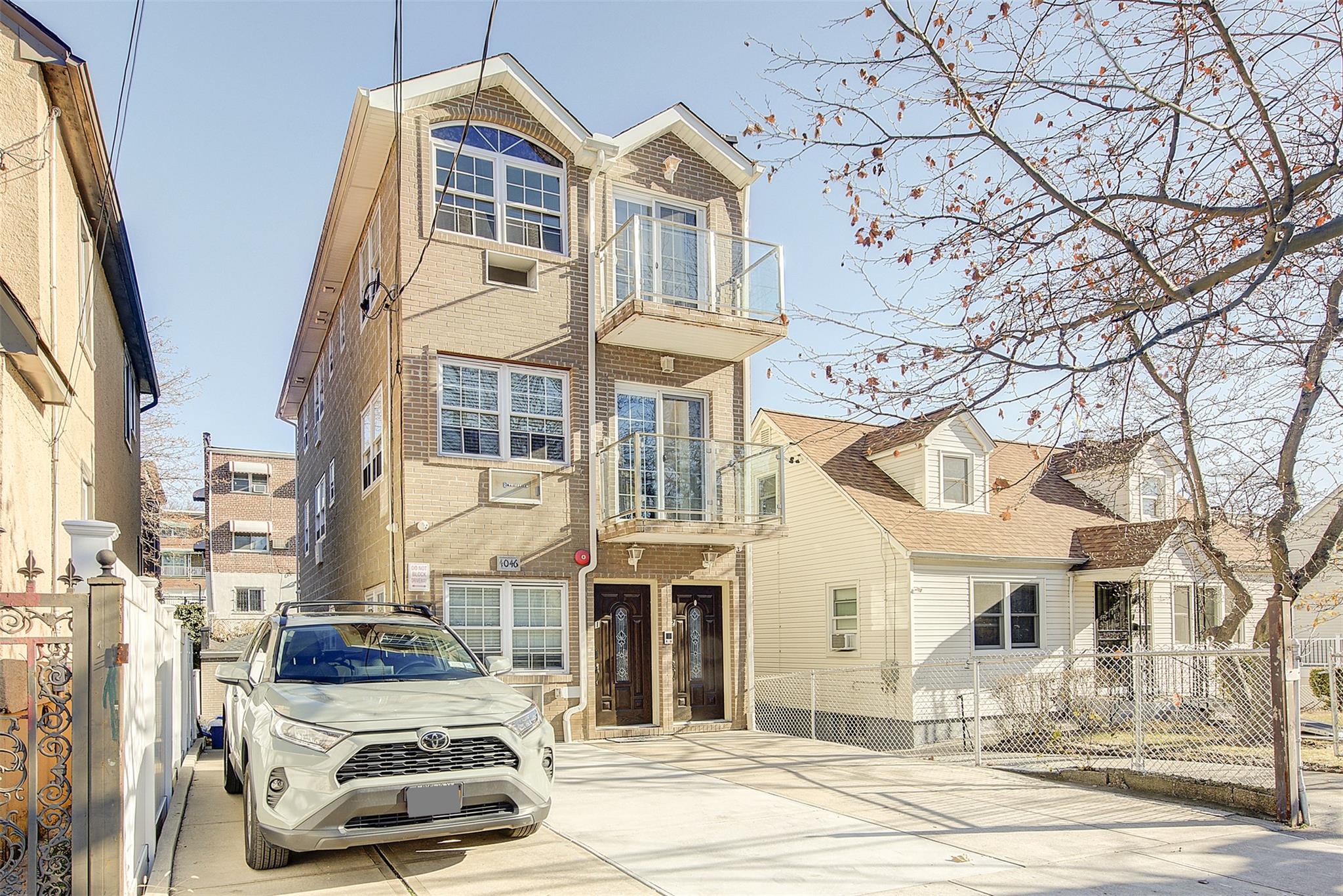 View of front of home with a balcony