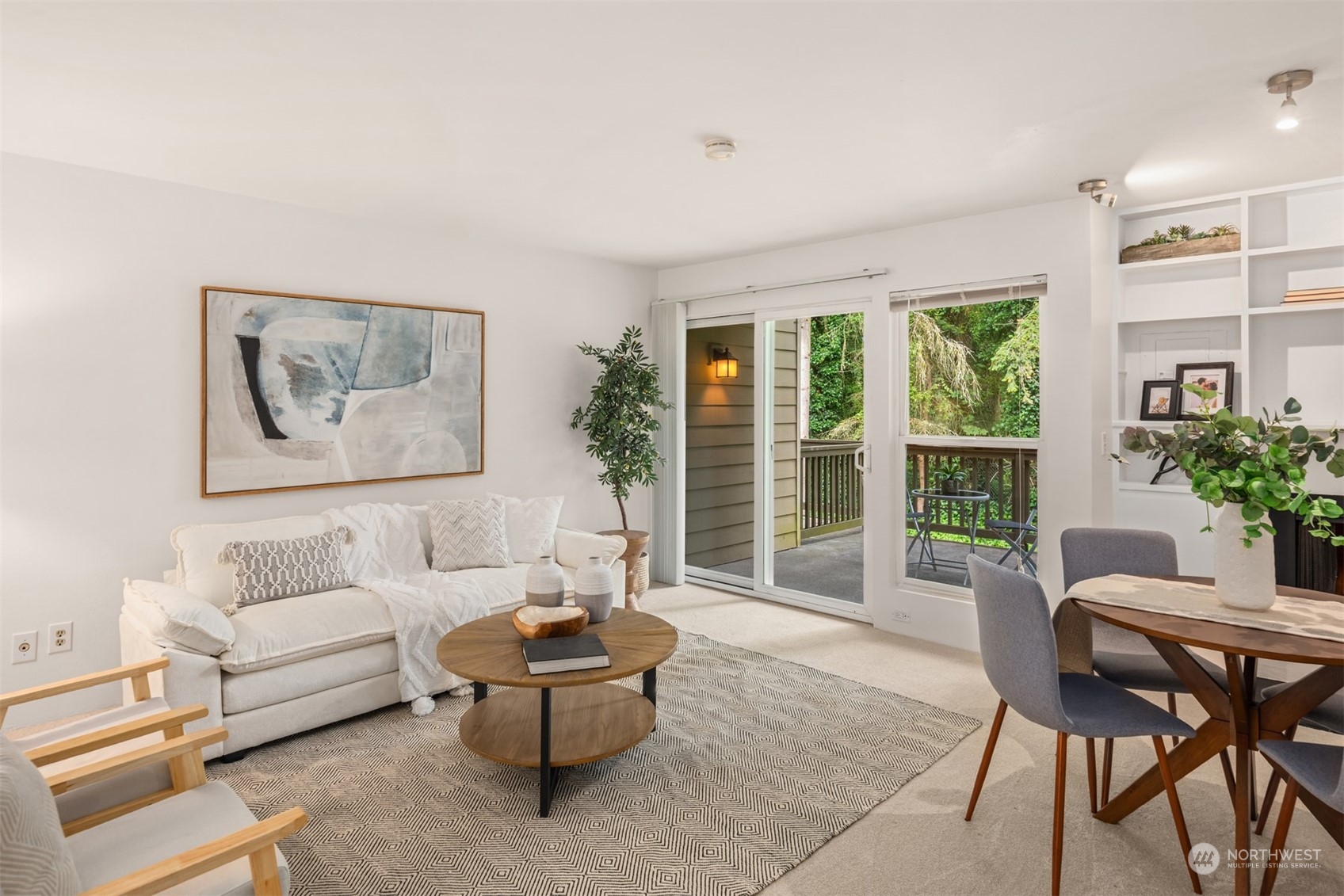 a living room with furniture and a potted plant