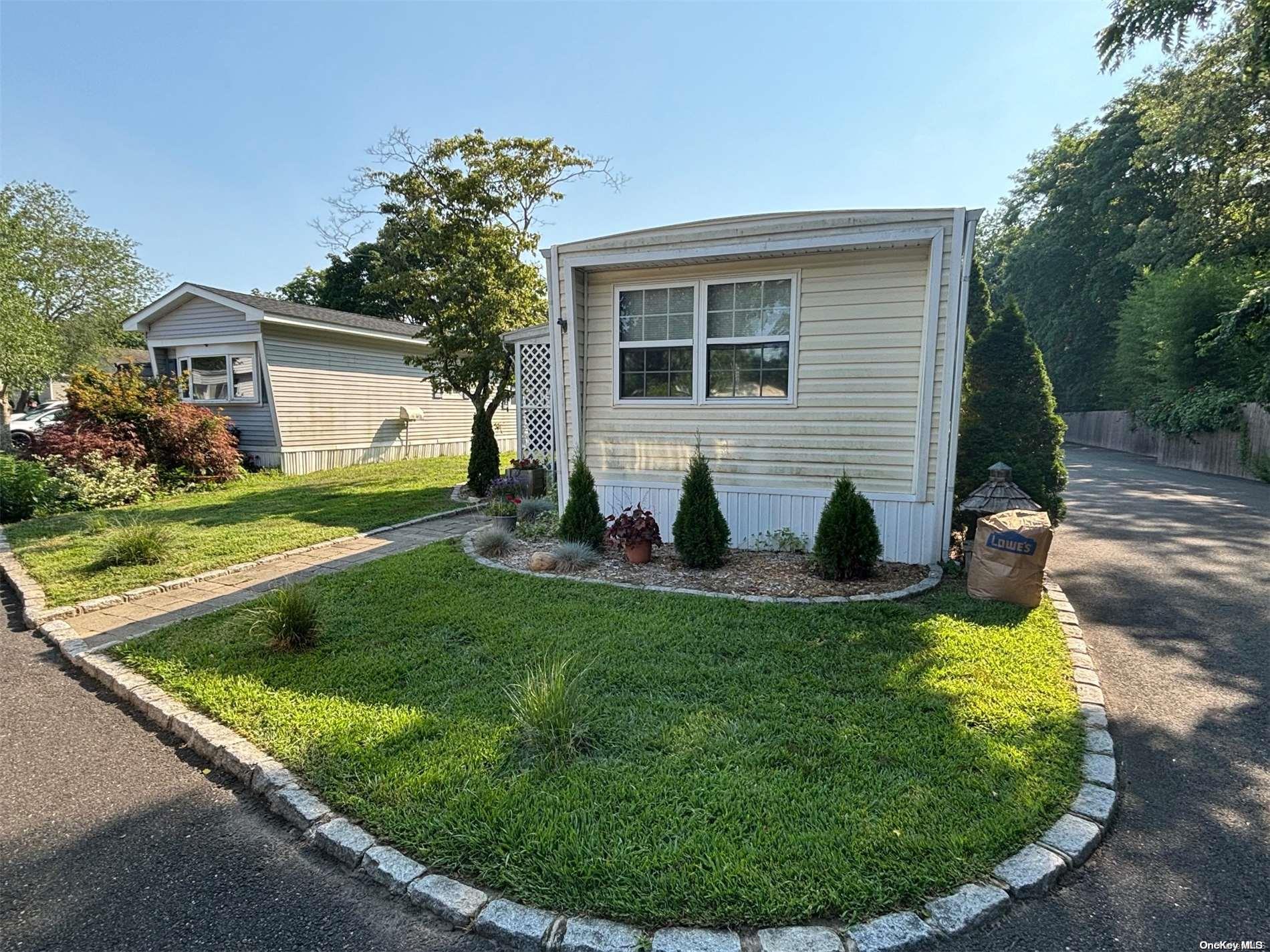 a view of a house with a backyard porch and sitting area