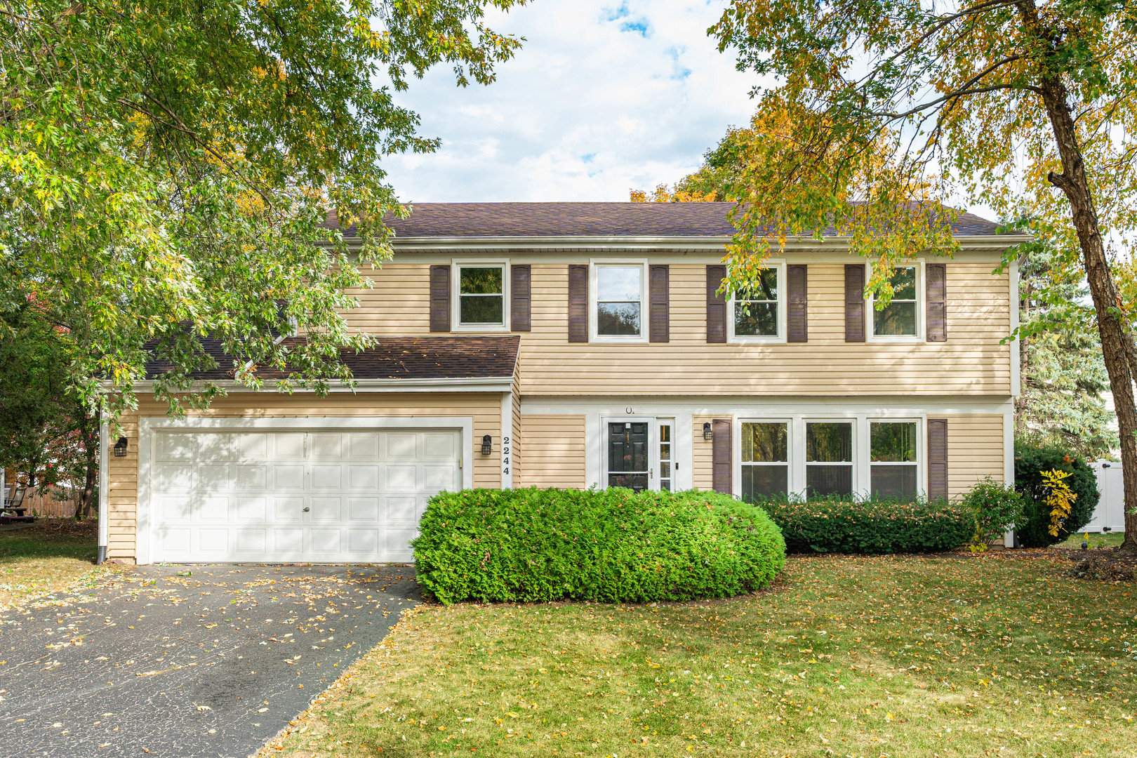 front view of a house with a yard