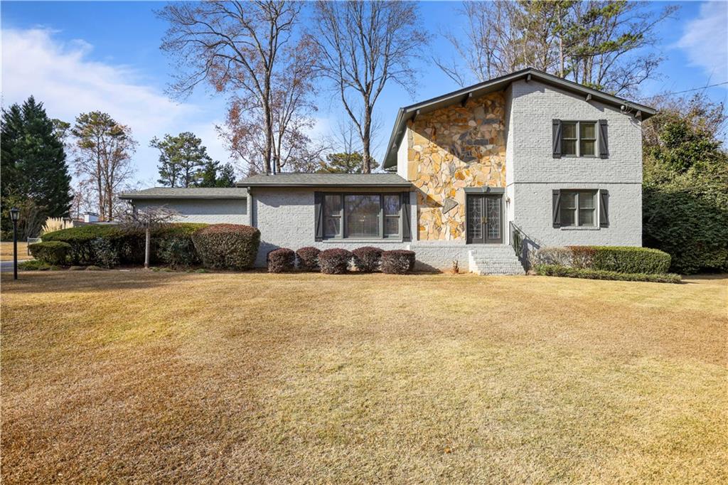 a front view of a house with a yard