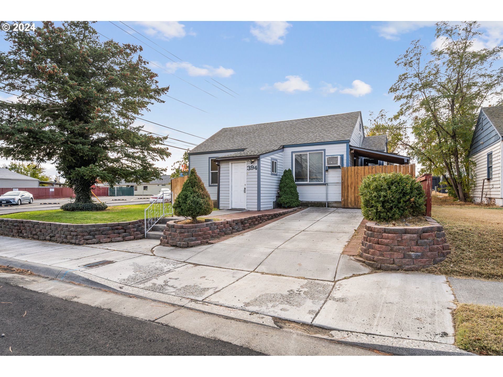 a front view of a house with a yard and a garage