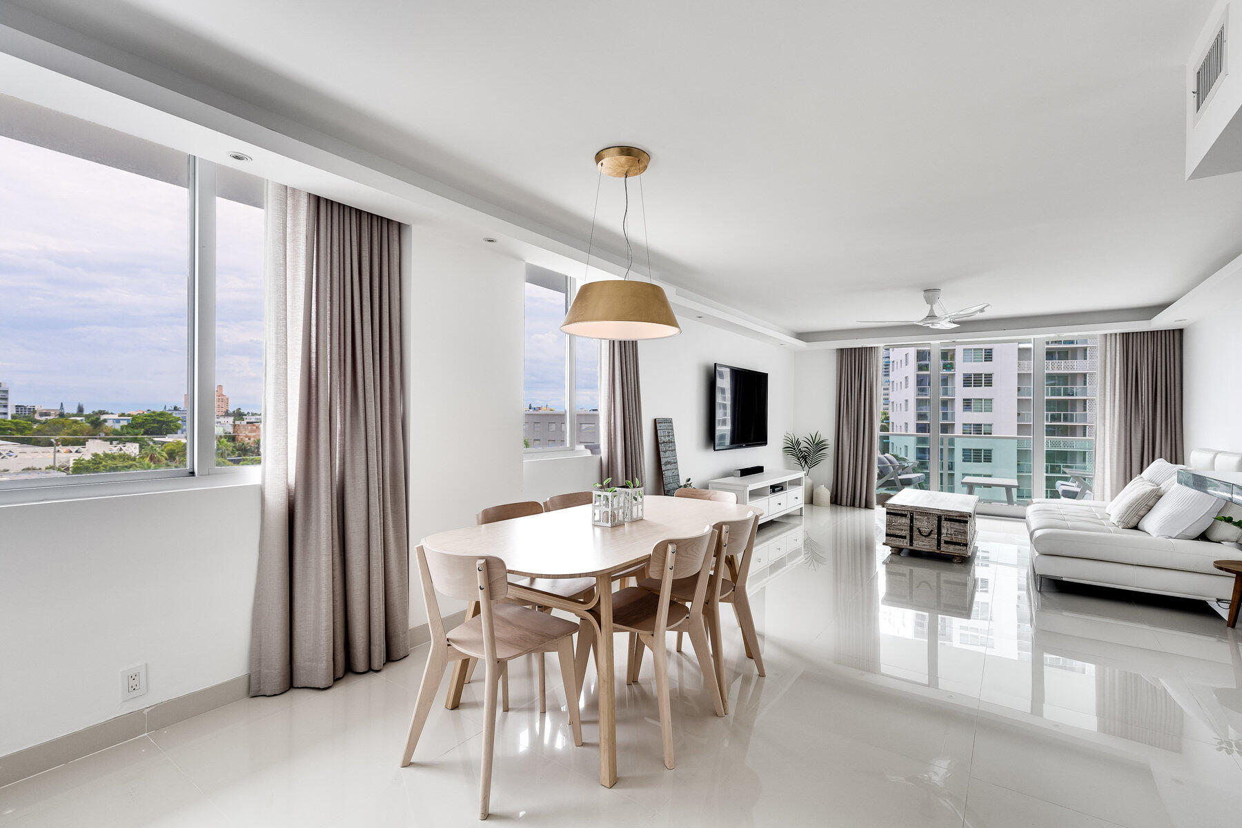 a view of a dining room with furniture window and outside view