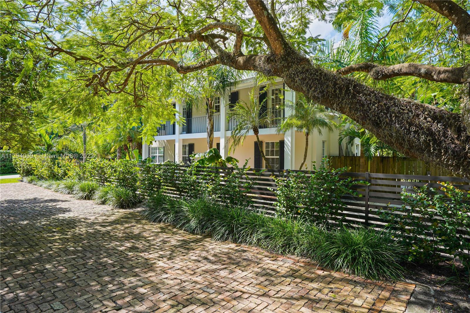 a view of a house with a tree