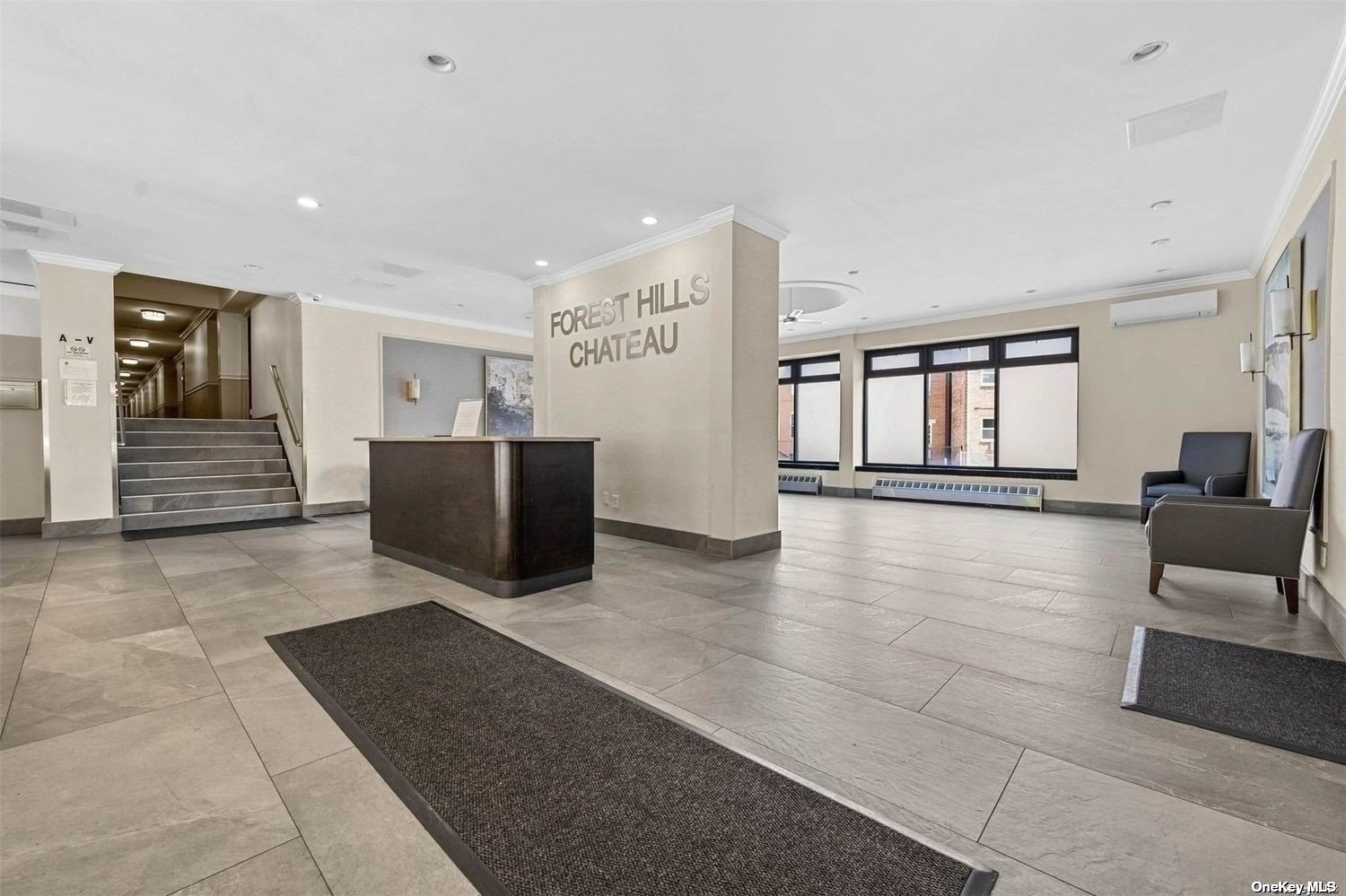 a lobby with furniture and window