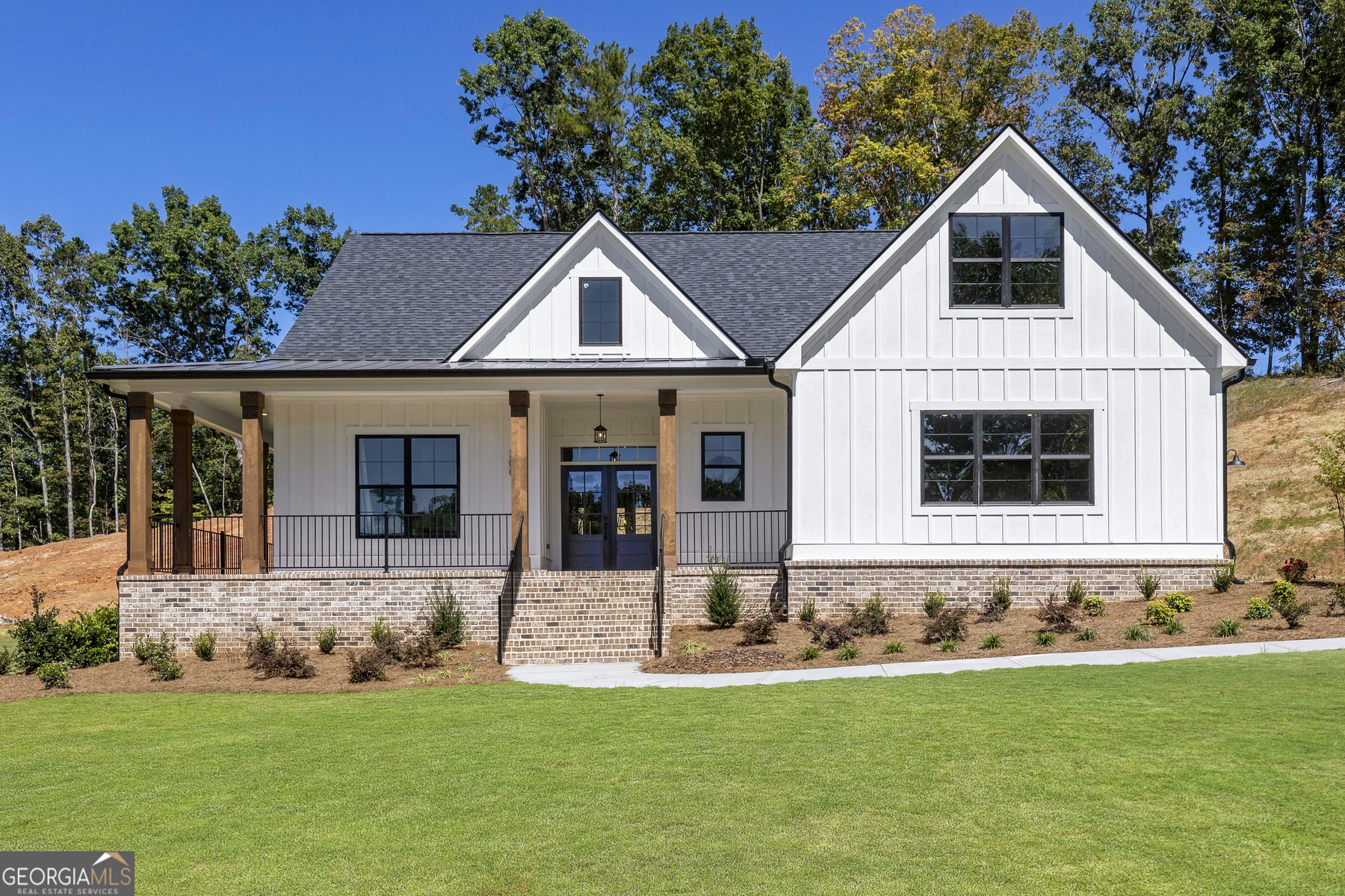 a front view of a house with a yard