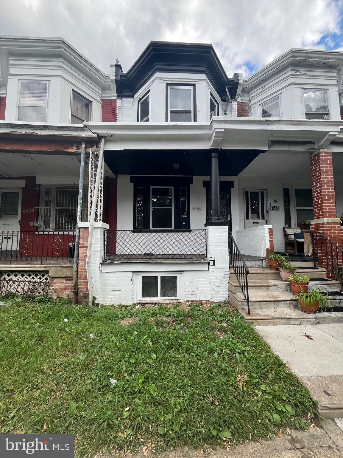 front view of a house with a small yard