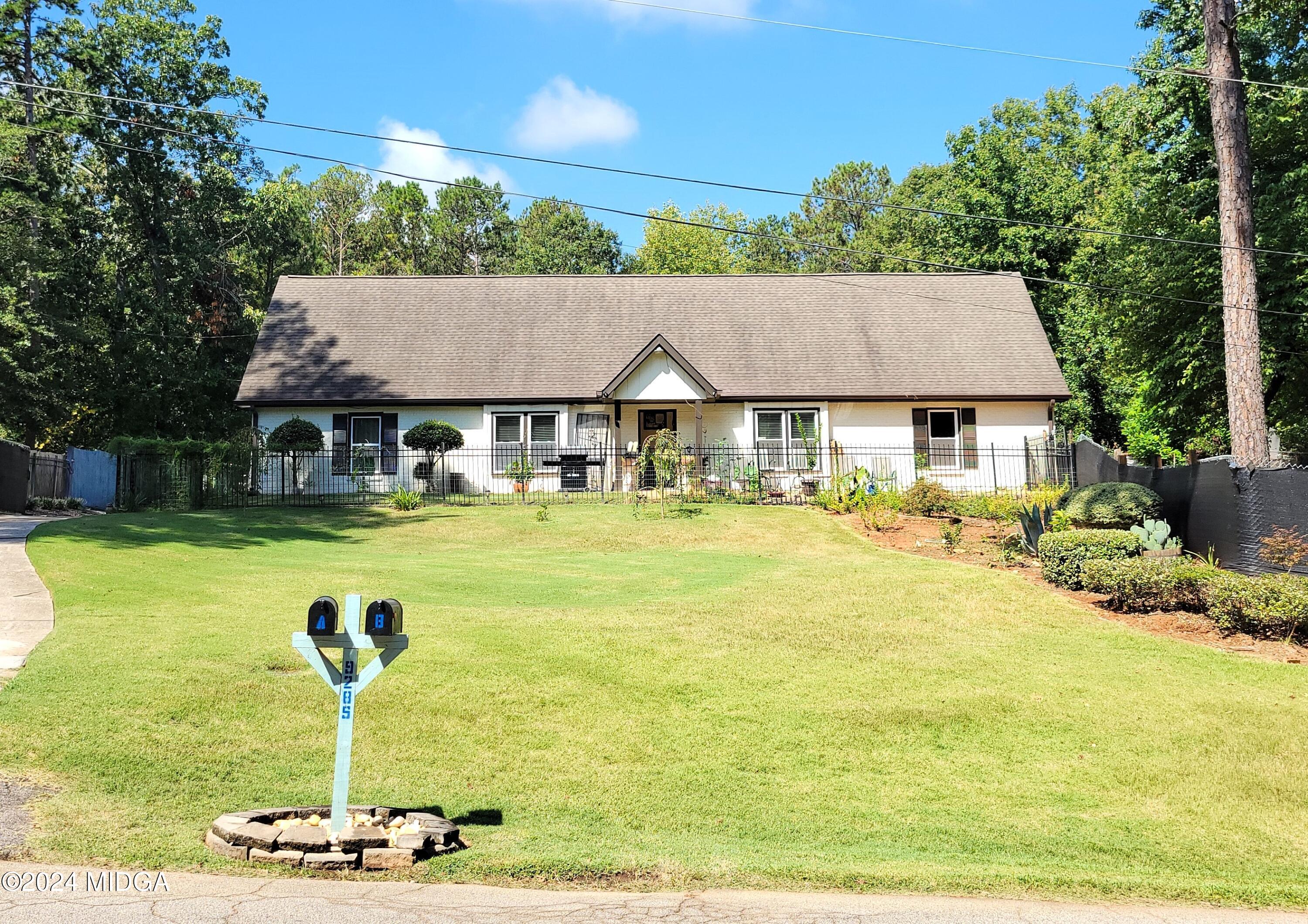 a front view of a house with swimming pool