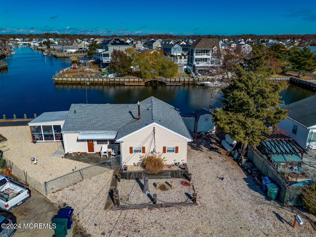 an aerial view of a house with ocean view