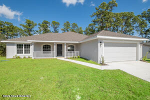 front view of a house with a yard