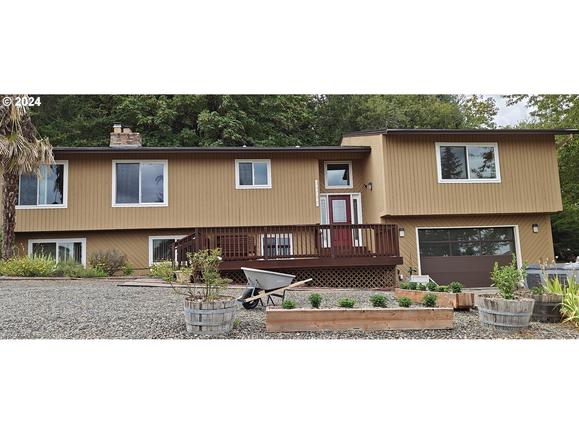 a front view of a house with yard