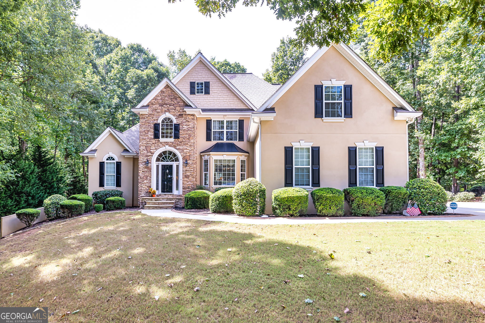 a front view of a house with a yard