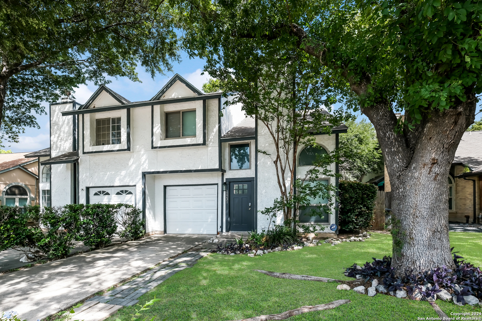 front view of a house with a yard