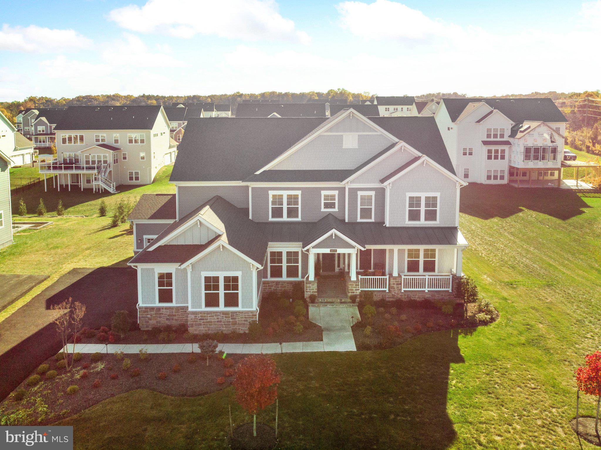 an aerial view of residential houses with yard