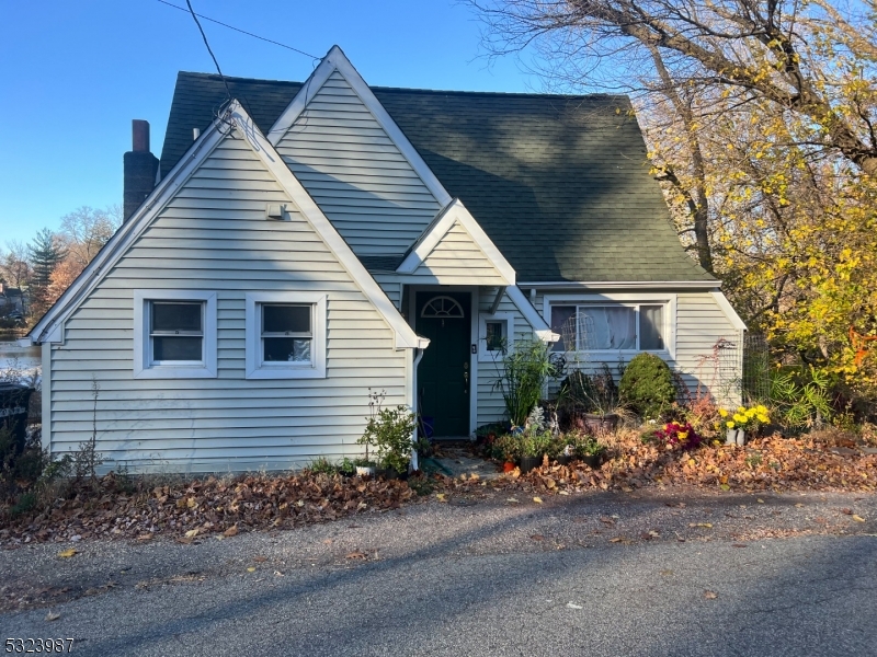 a view of a house next to a yard