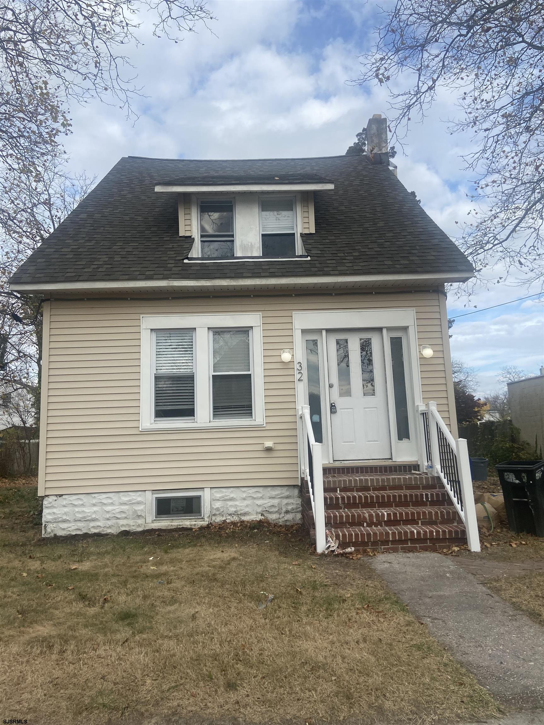 a front view of a house with a fence