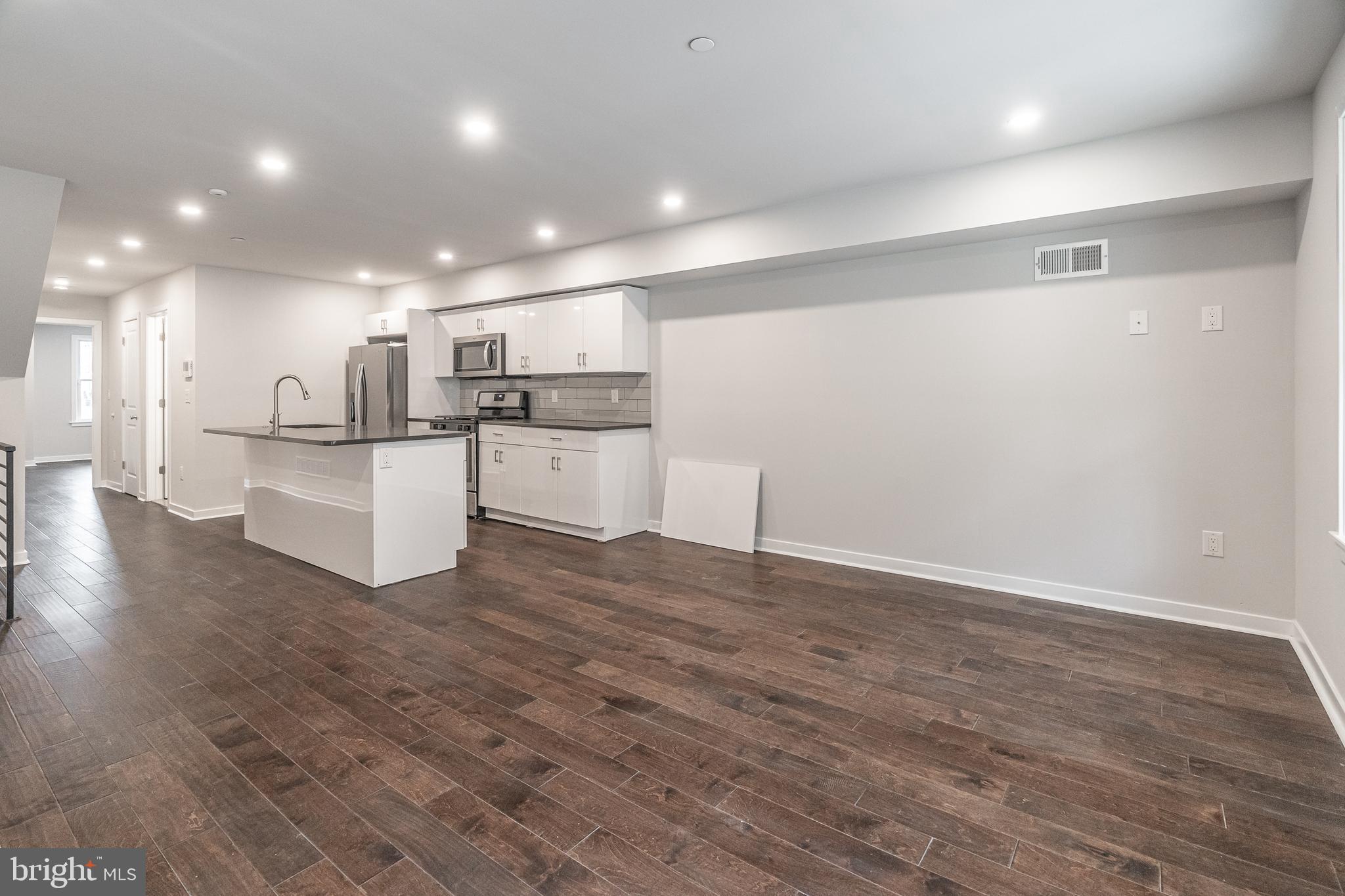 a view of kitchen with wooden floor