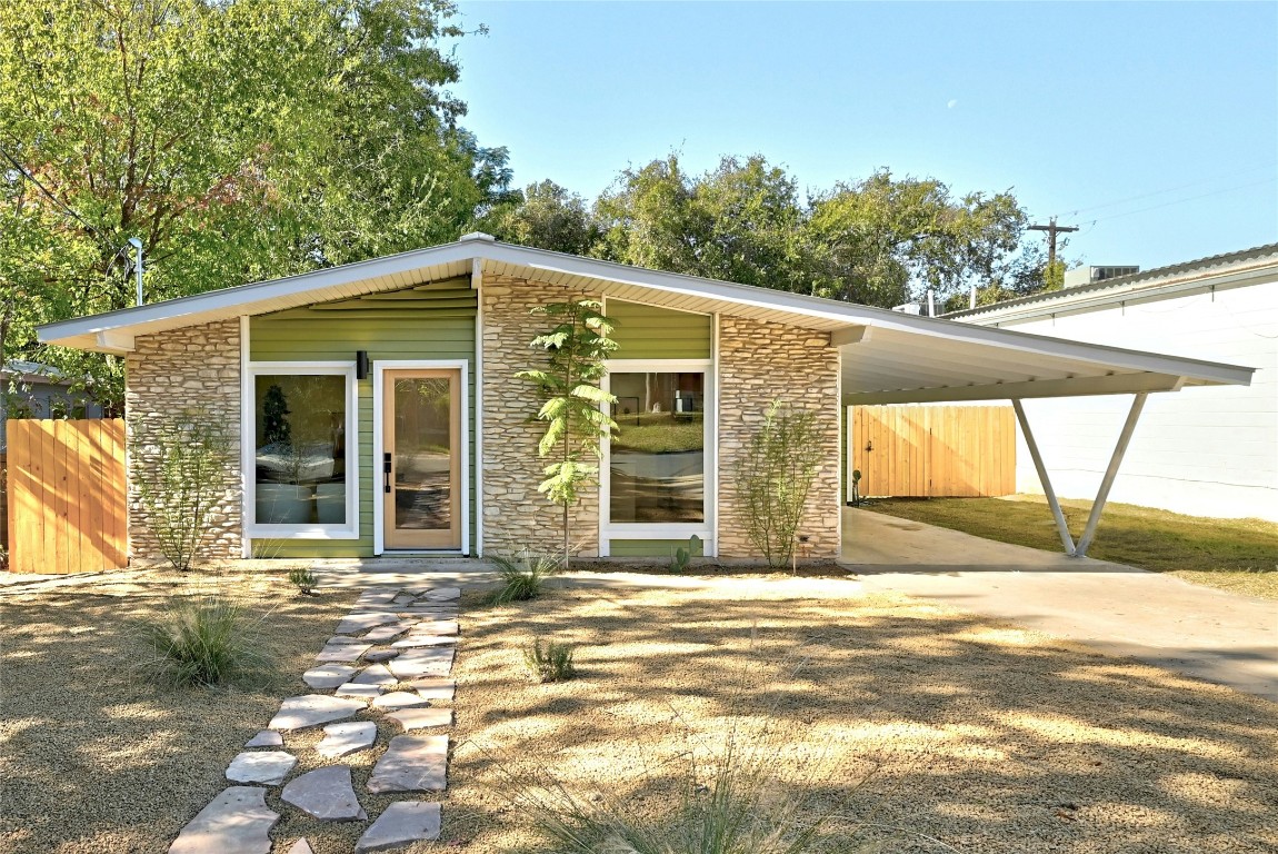 a view of a house with a tree