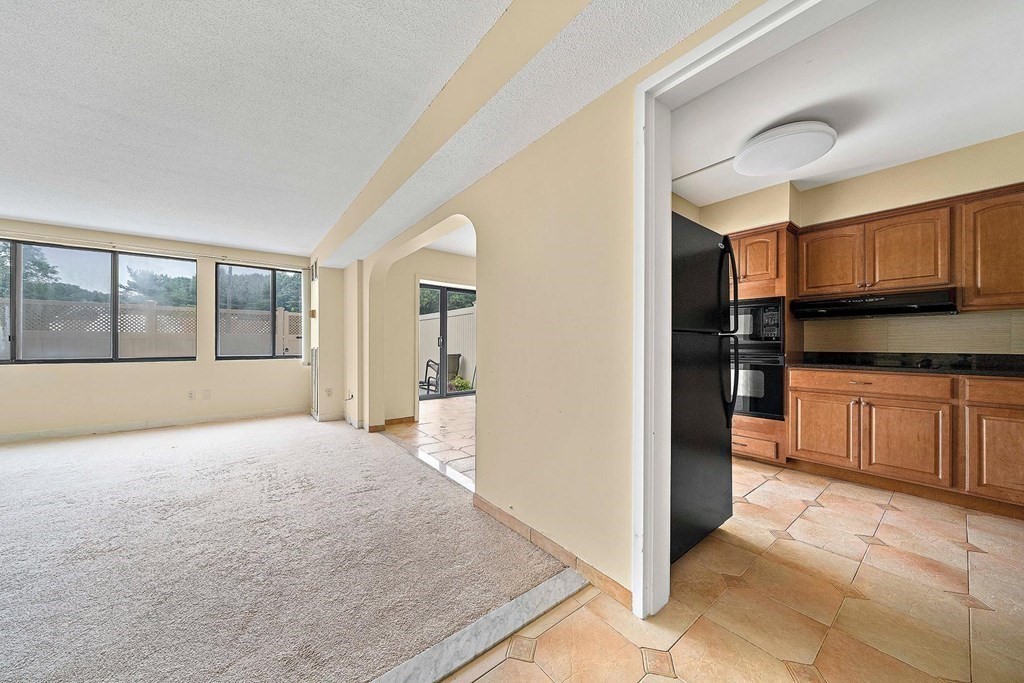 a view of a kitchen with a sink and cabinets