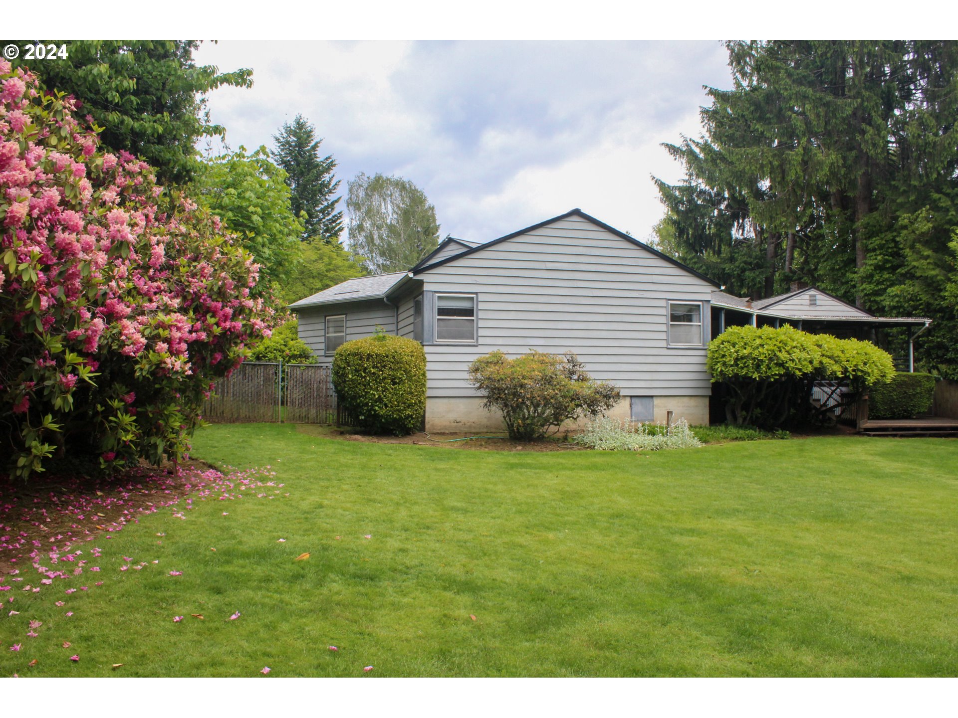 a view of a house with a garden