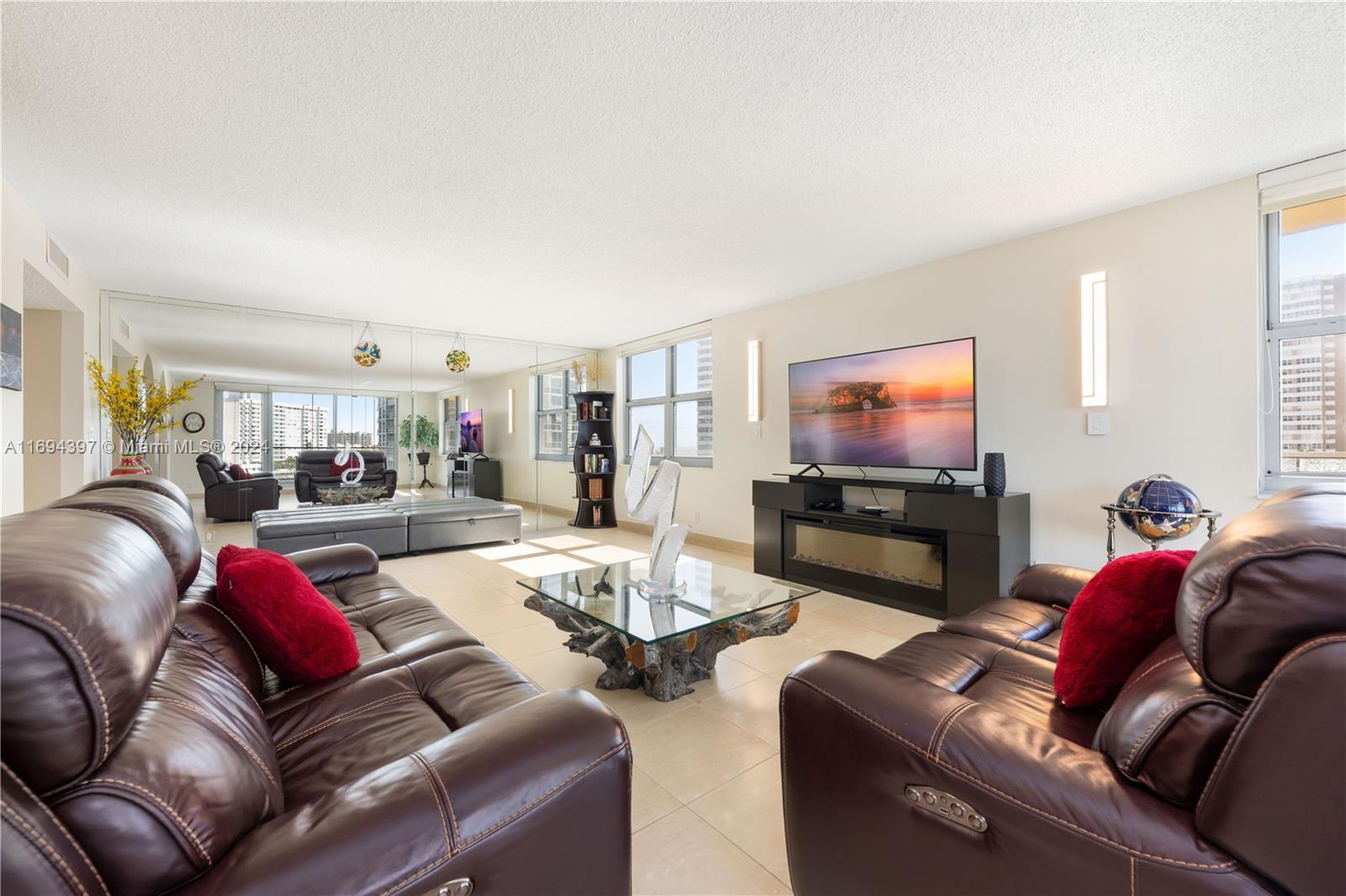 a living room with furniture and a flat screen tv