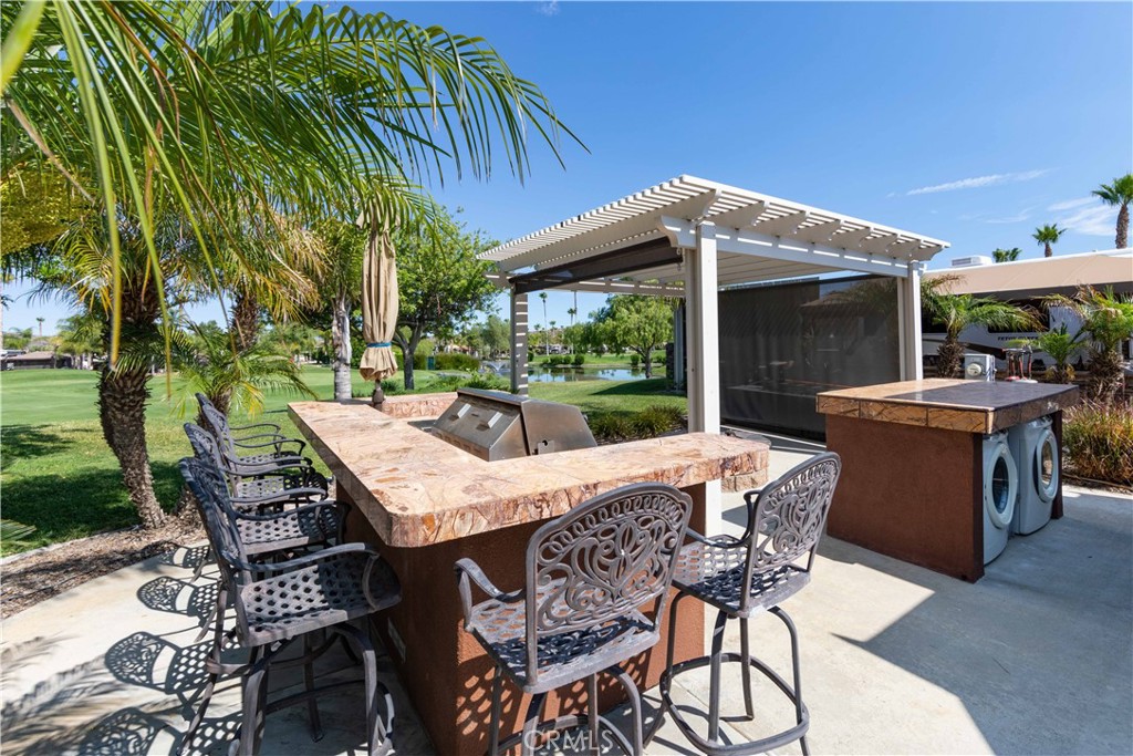 a view of a patio with furniture