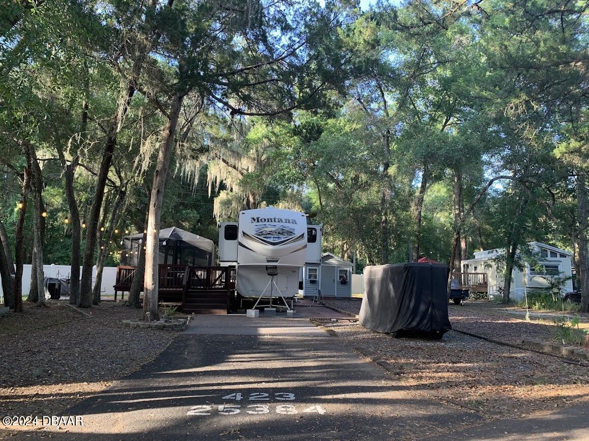 a view of a back yard of the house