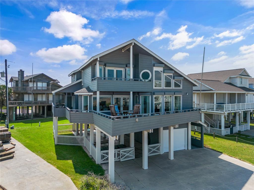 a front view of a house with swimming pool having outdoor seating