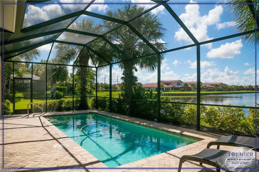 a view of backyard with swimming pool and outdoor seating