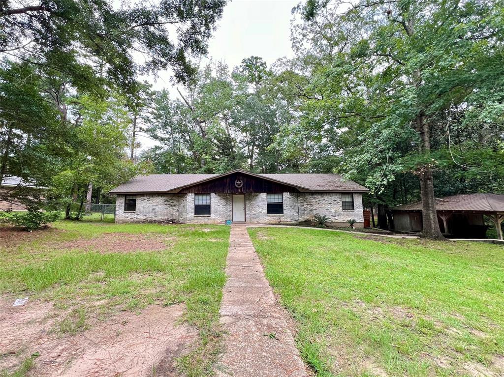 a front view of a house with yard