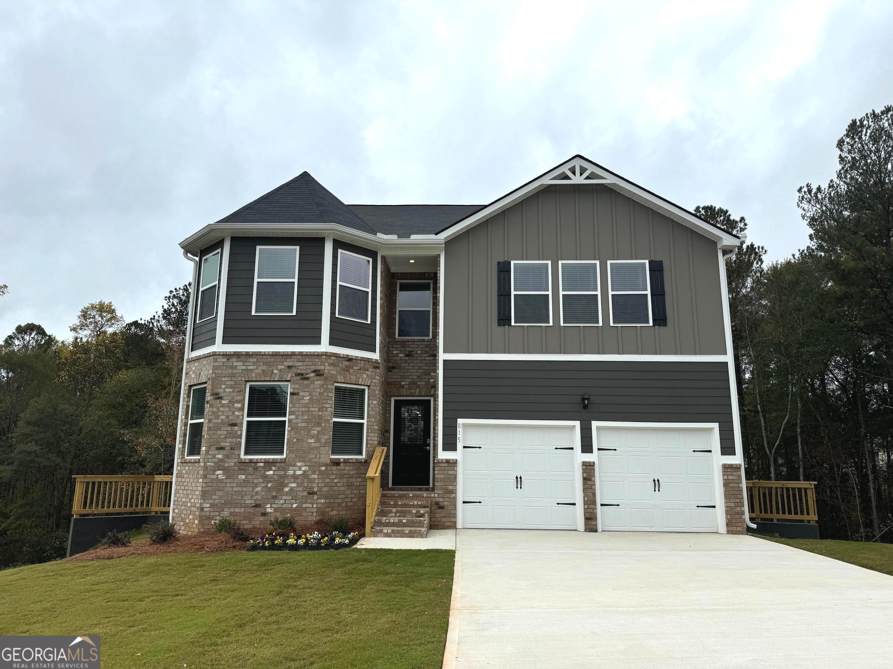 a front view of a house with a yard