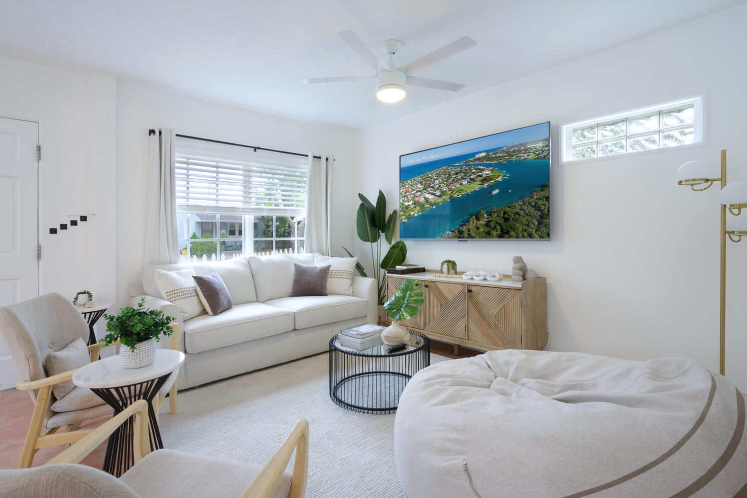 a living room with furniture and a flat screen tv