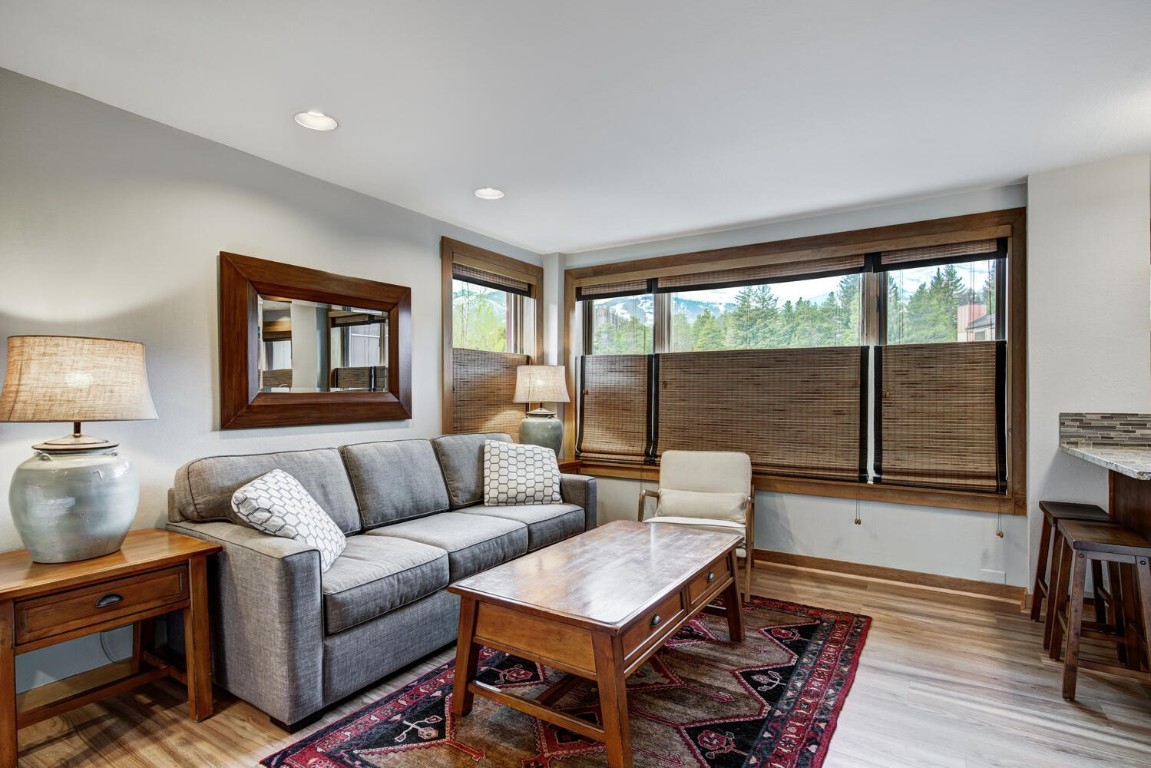 End unit, living room with luxury vinyl flooring