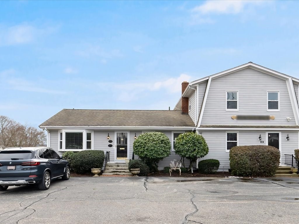 a view of a car park in front of a house