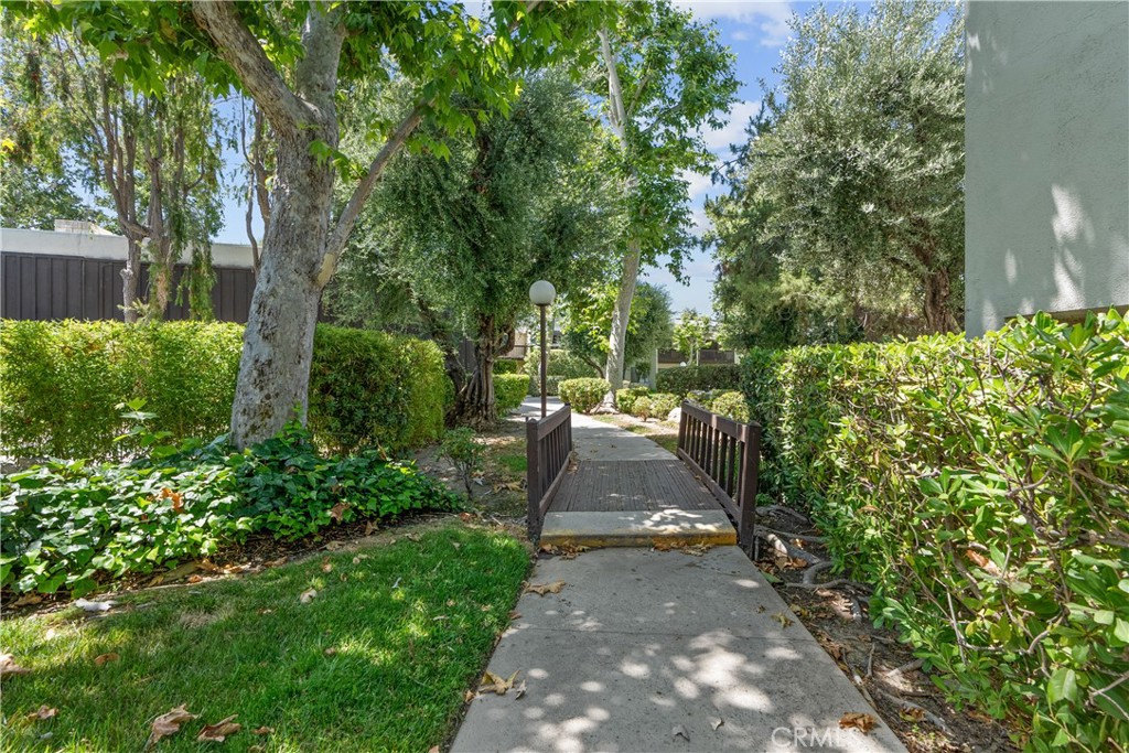 a view of a pathway both side of yard