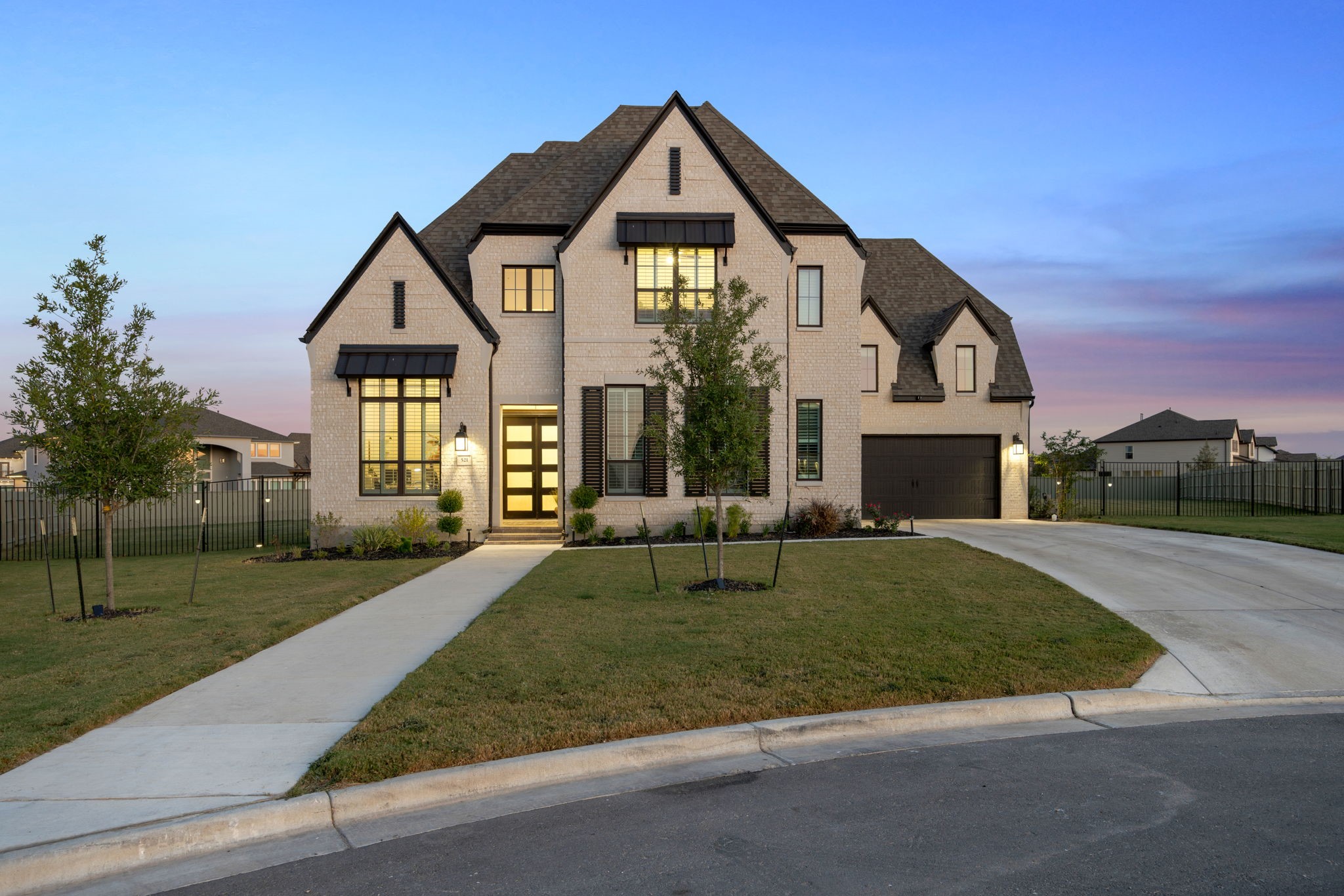 a front view of a house with a yard