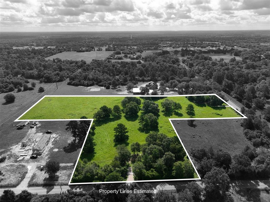 an aerial view of house with a garden