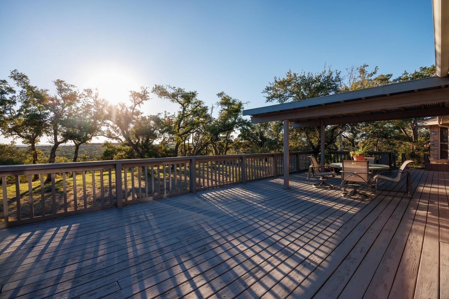 a view of a balcony with wooden floor