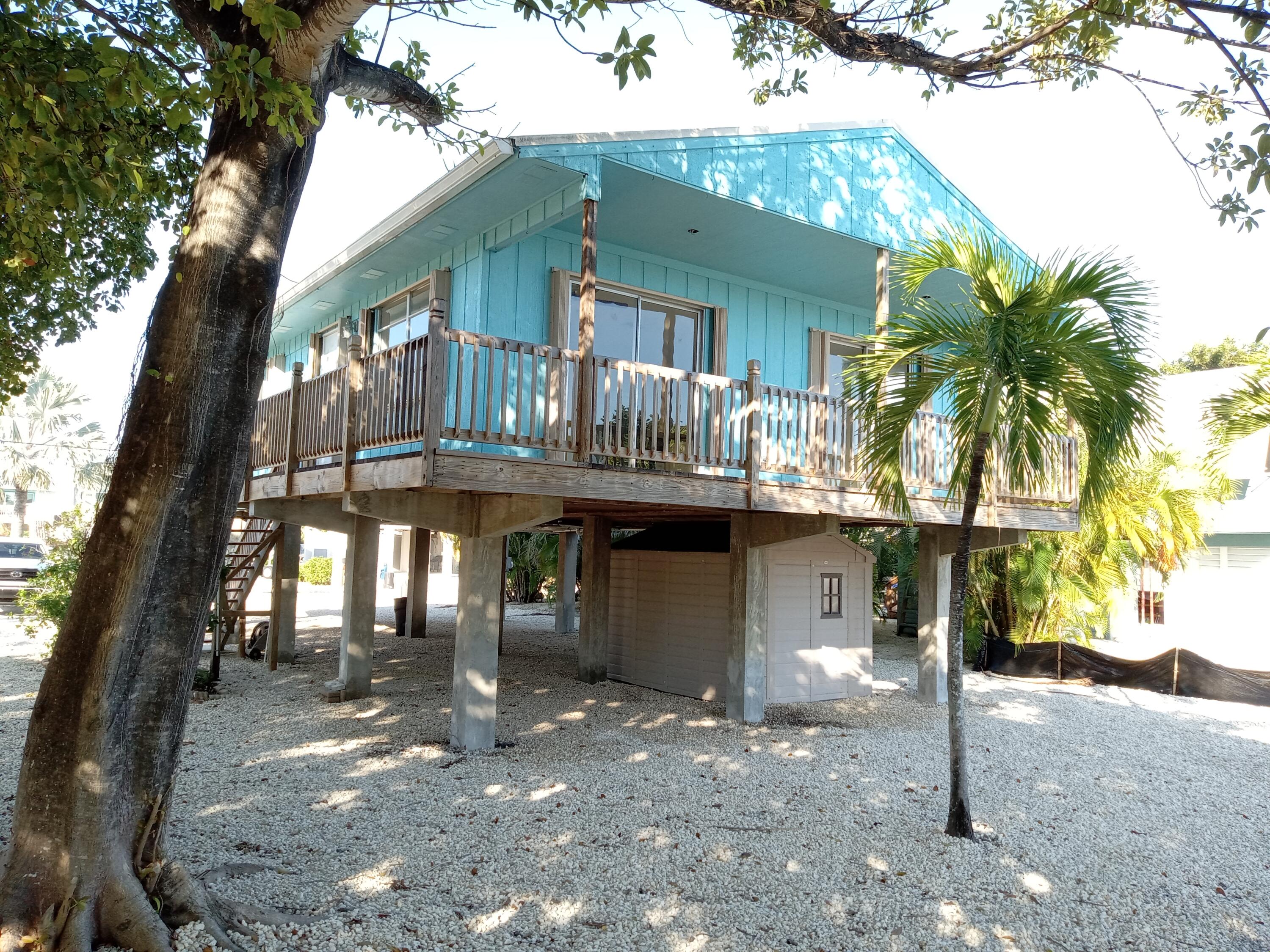 a view of a house with a tree