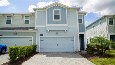 a front view of a house with a garage