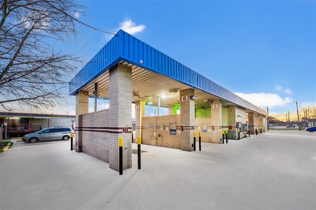 a view of a building with car parked