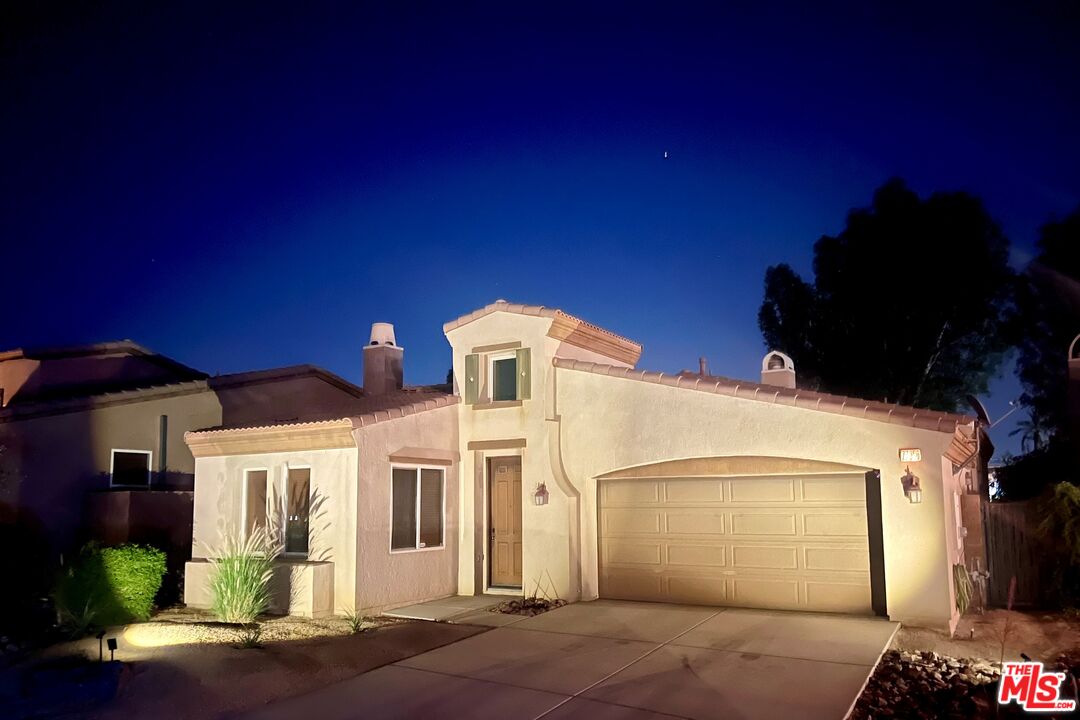 a front view of a house with a garage