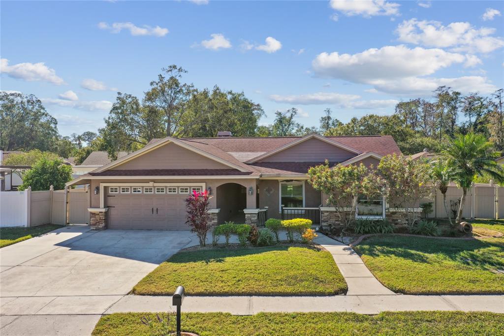 a front view of a house with garden