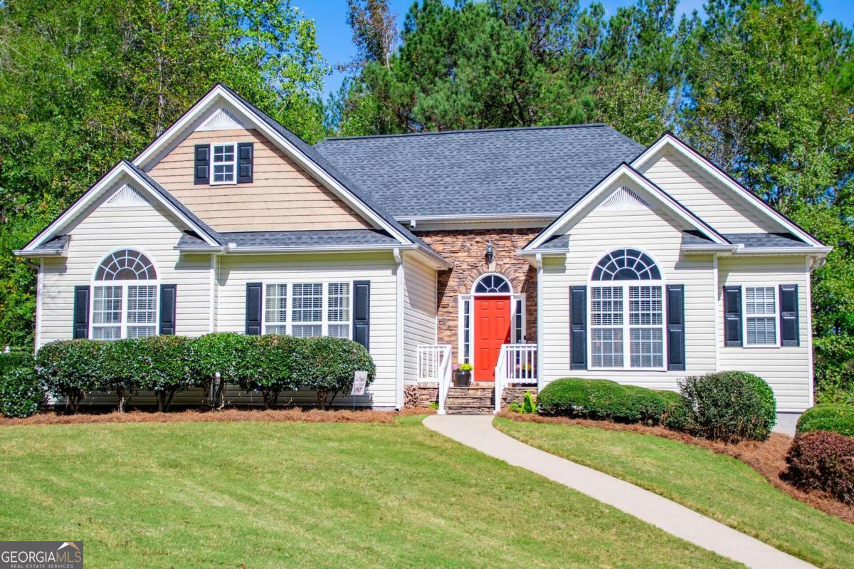 a front view of a house with a yard