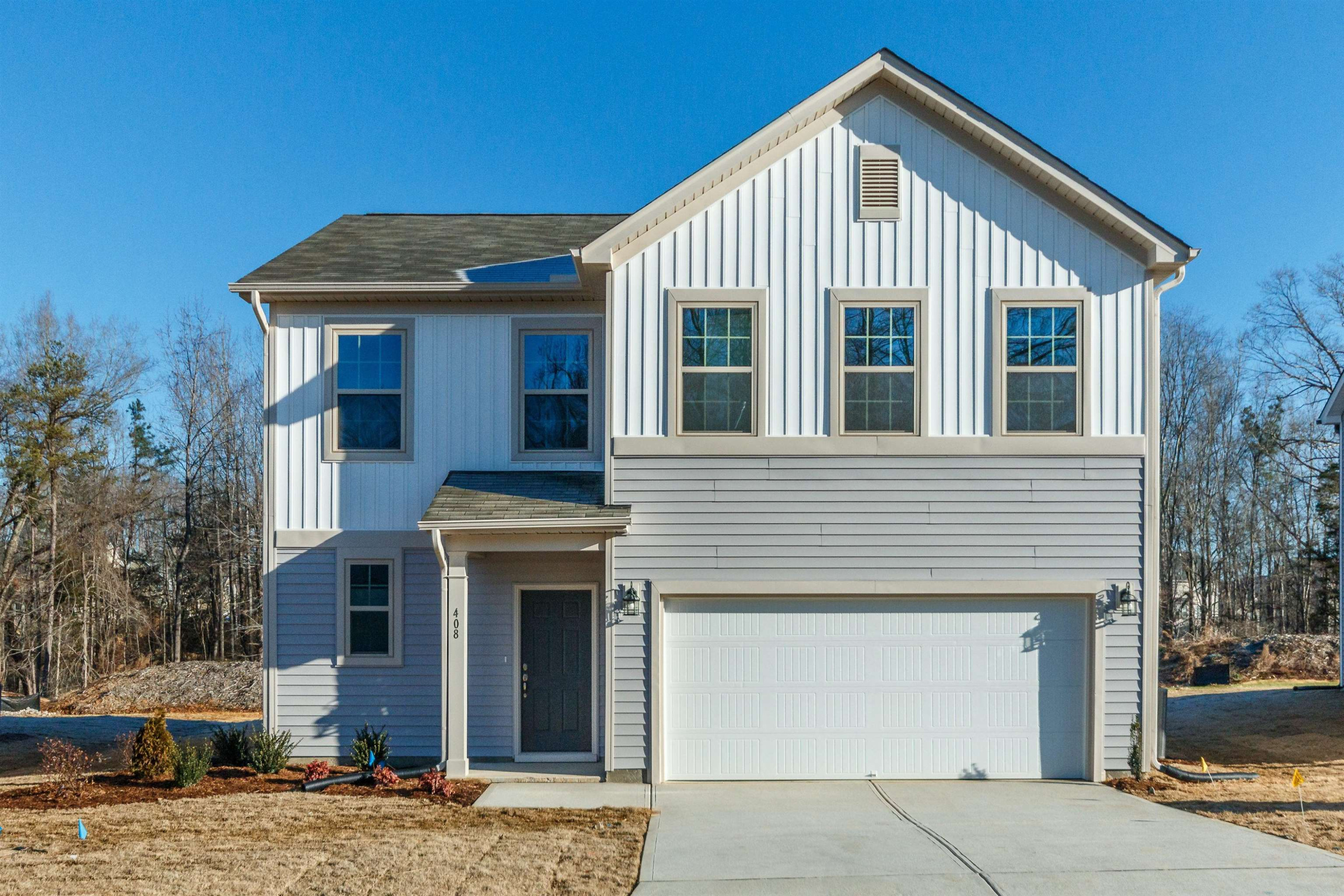 a front view of a house with garage