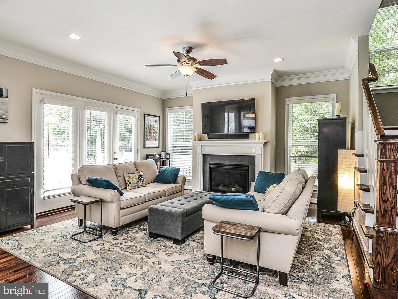 a living room with furniture fireplace and a flat screen tv