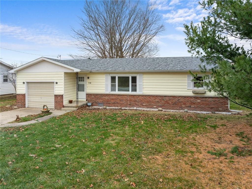 a view of a house with a backyard