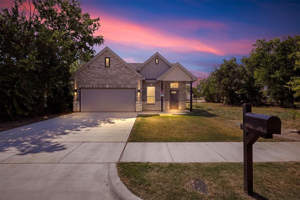 a front view of a house with yard