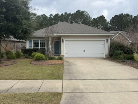 a front view of house with garage and yard