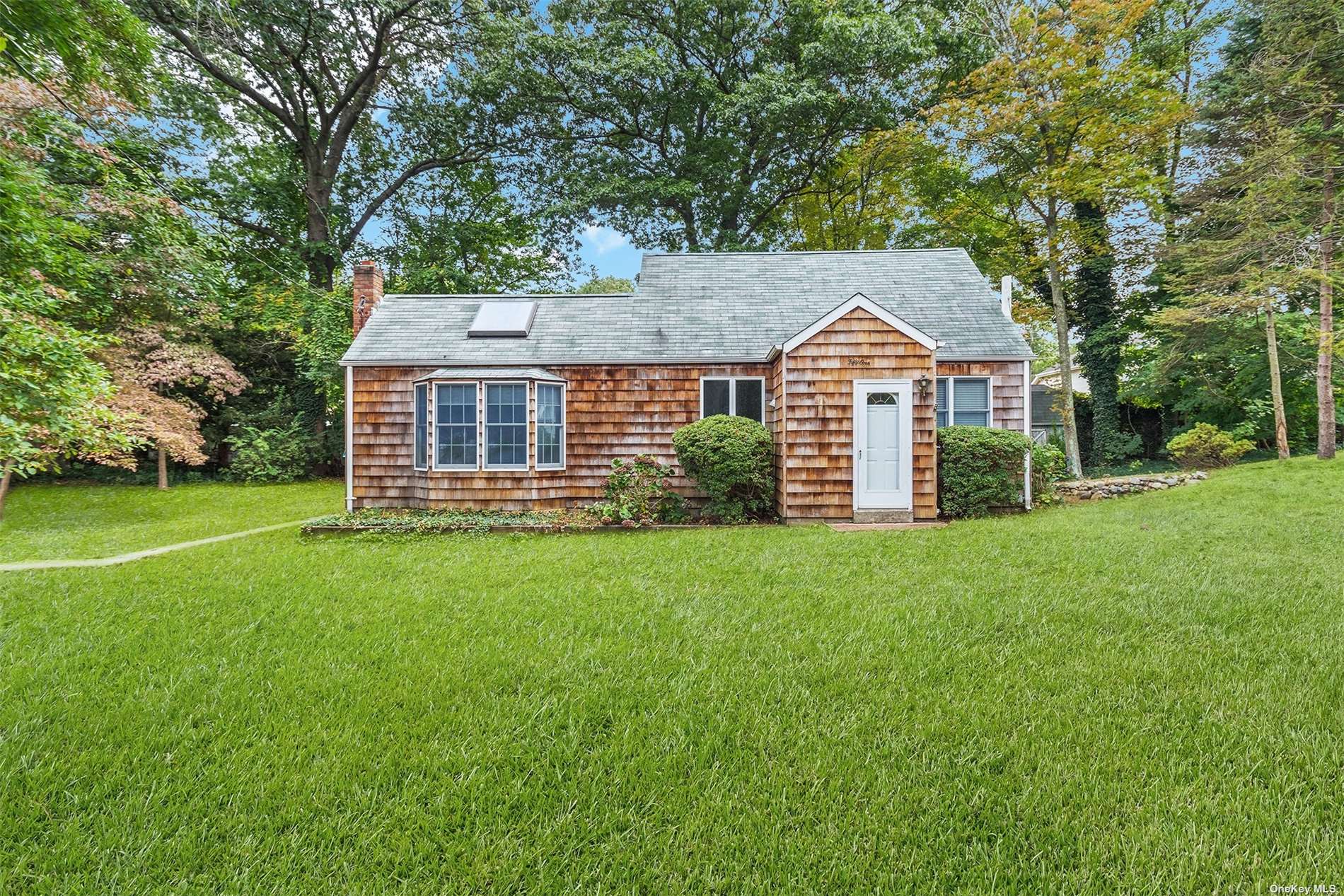 front view of a house with a yard